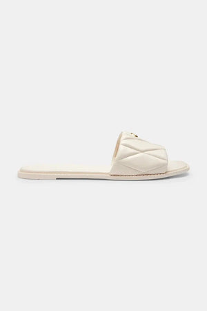 Sandalia Coach Holly Quilted Leather de piel plana para mujer
