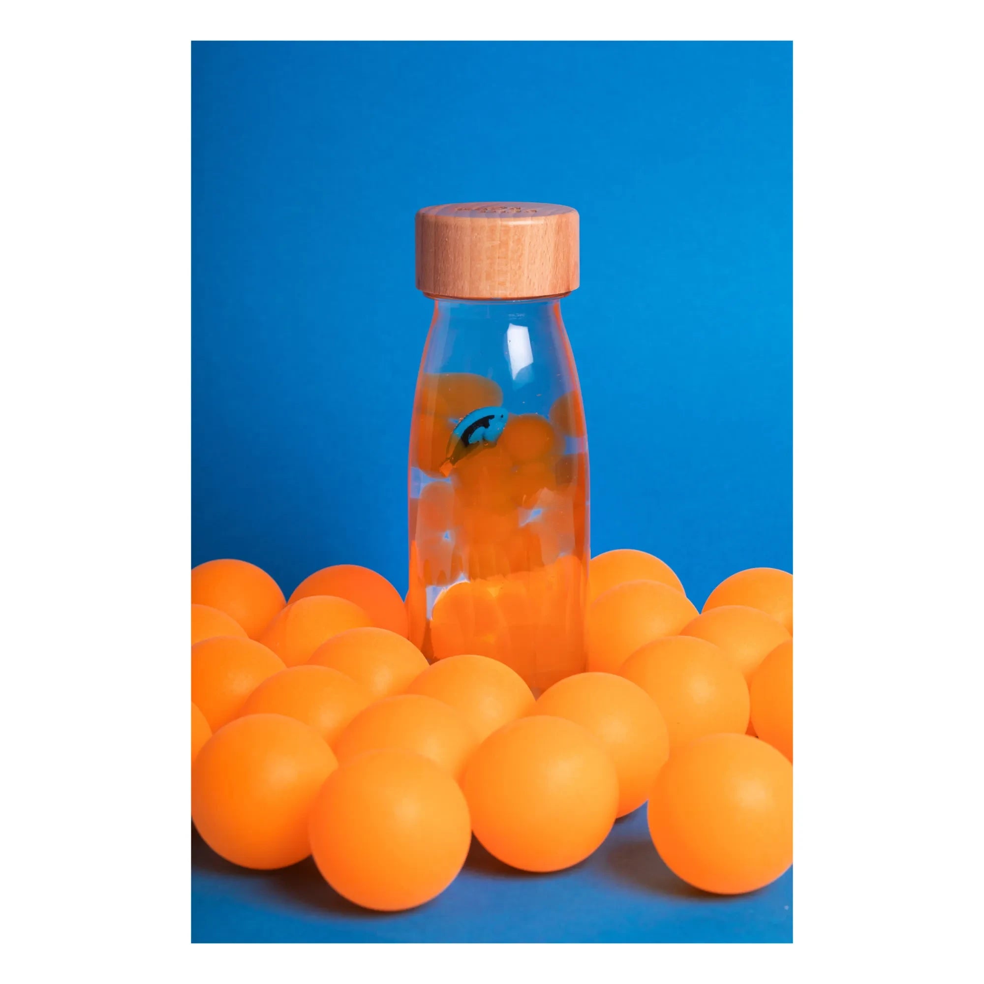 Petit Boum - Botella sensorial de peces | Naranja