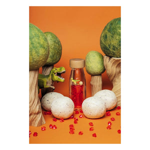 Petit Boum - Botella sensorial T-Rex | Naranja