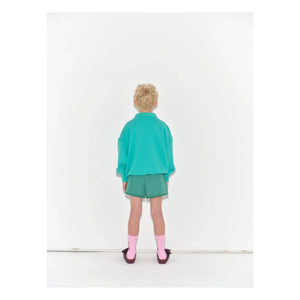 Main Story - Shorts de jogging recortados de algodón orgánico | Verde