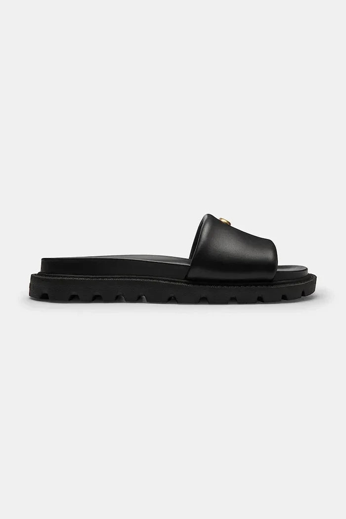 Sandalia plana de cuero Coach Brynn Leather Slide para mujer