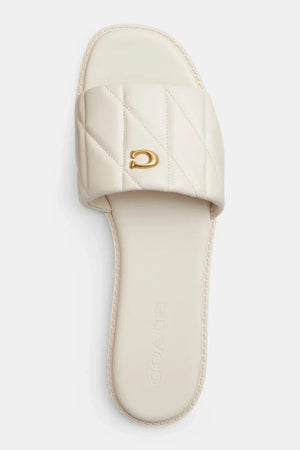 Sandalia Coach Holly Quilted Leather de piel plana para mujer