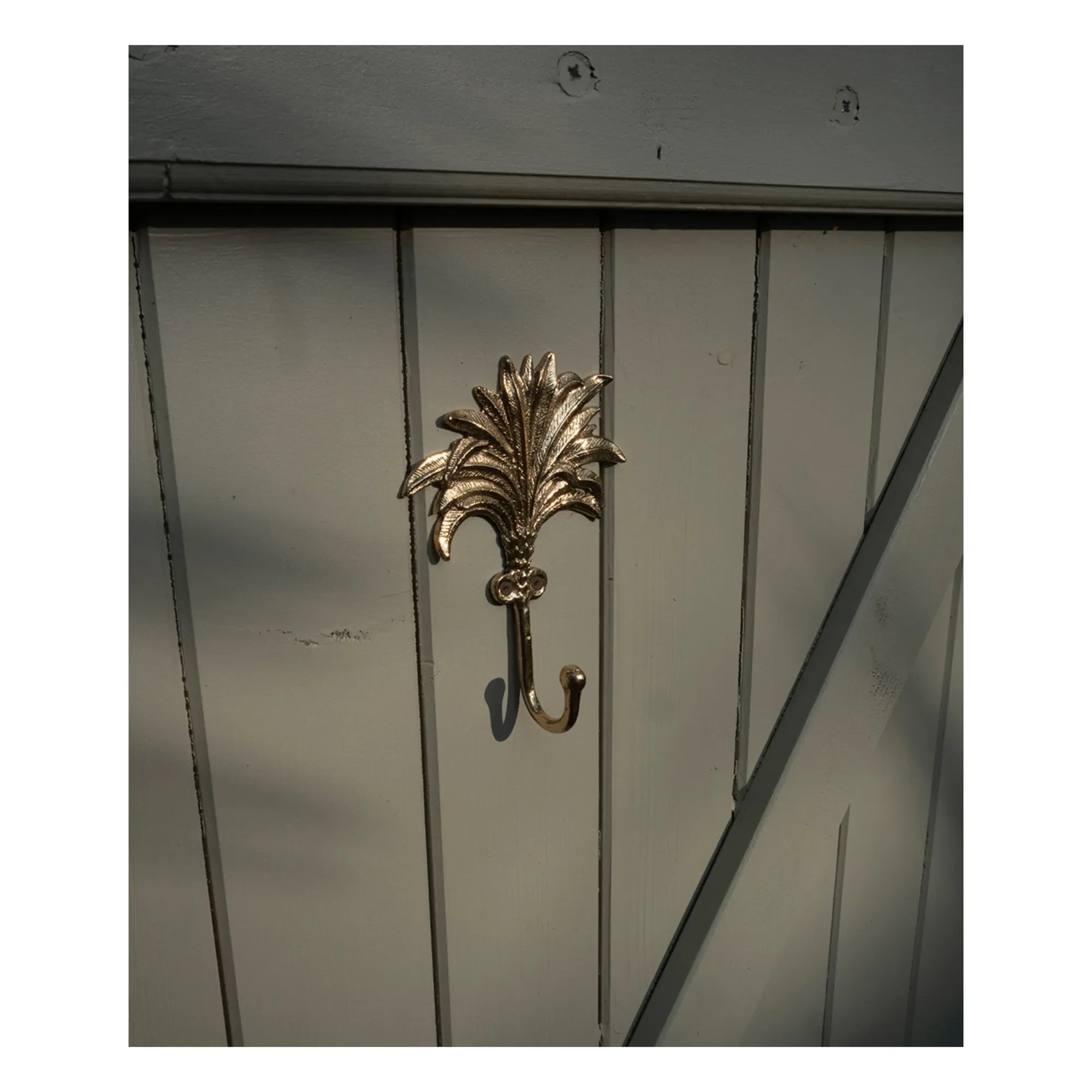 Doing Goods - Colgador de pared de latón Marlin | Dorado