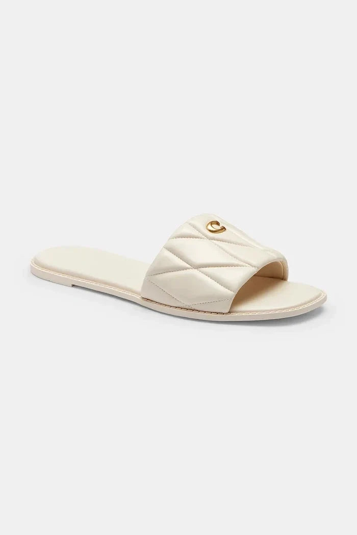 Sandalia Coach Holly Quilted Leather de piel plana para mujer