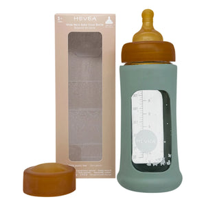 Hevea - Biberón de vidrio de boca ancha con flujo medio y funda protectora | Verde almendra
