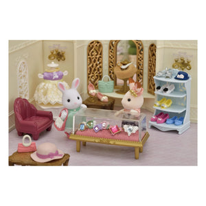 Sylvanian Families - Conejita Hermana Mayor y Maleta de Moda