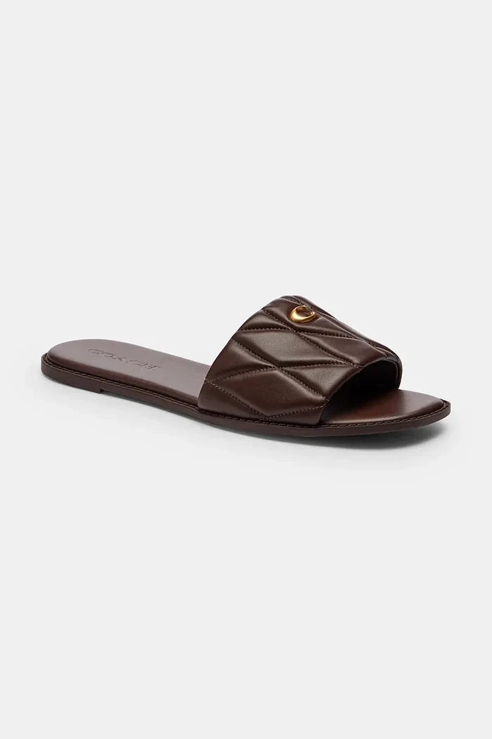 Sandalias planas de piel Coach Holly Quilted de mujer