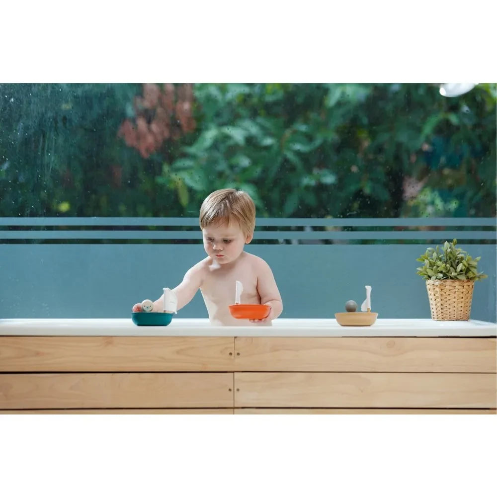 Plan Toys - Barco flotante Pingüino