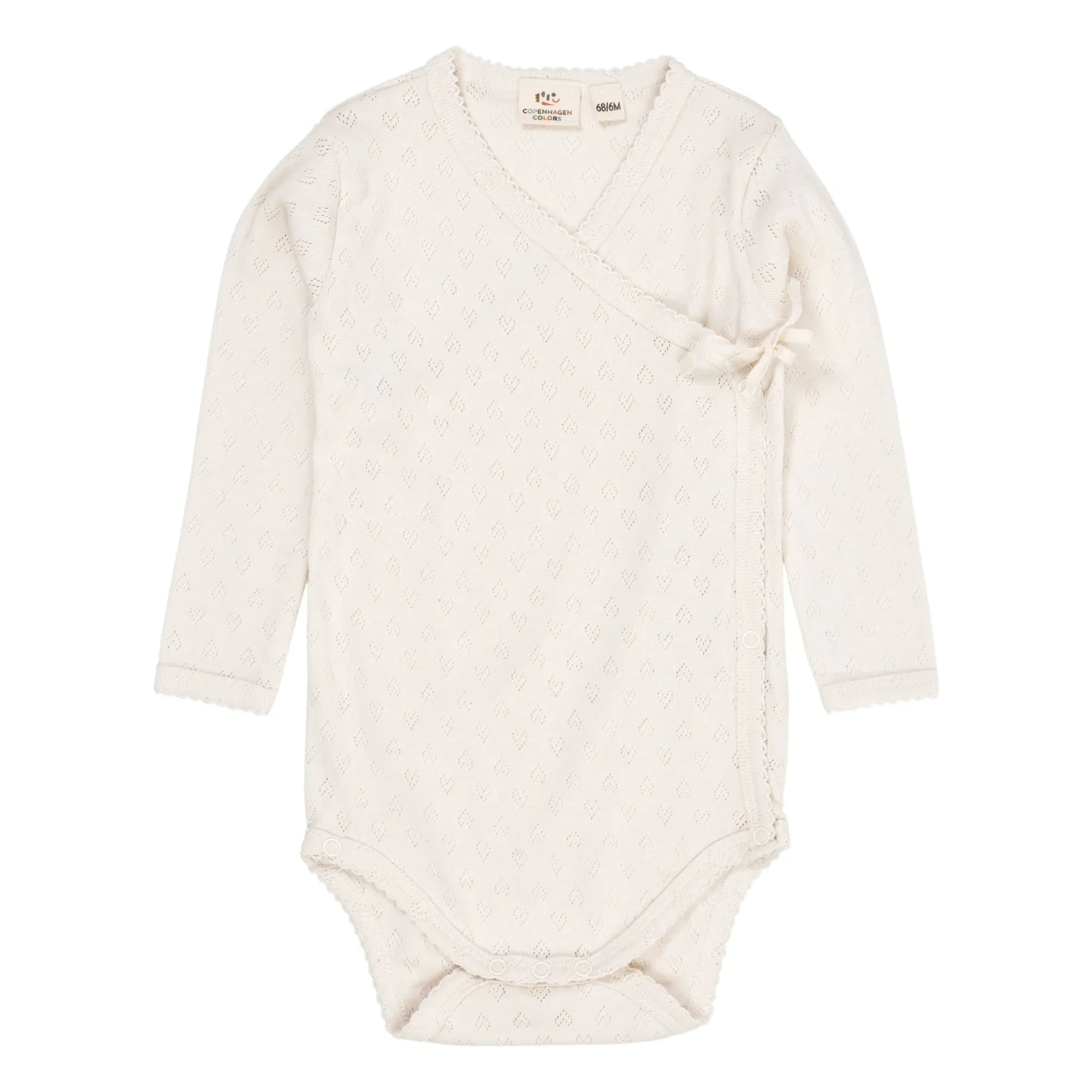 Copenhagen Colors - Body de algodón orgánico con cuello cruzado y punto calado | Crema
