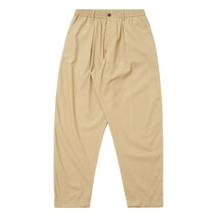 Universal Works - Pantalón de chándal plisado de poliéster técnico | Beige