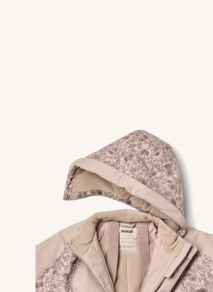 Wheat - Mono de esquí Melte Fleurs elaborado con fibras recicladas | Rosa claro