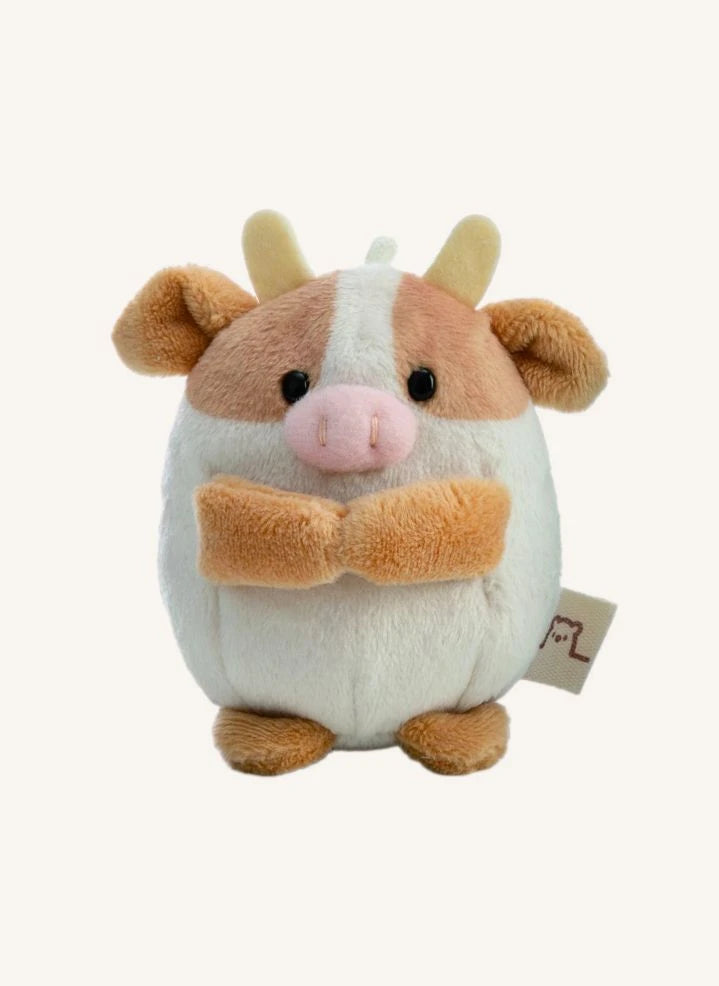 Nici - Juguete de peluche Moono la vaca, con disfraz de cartón de leche | Beige