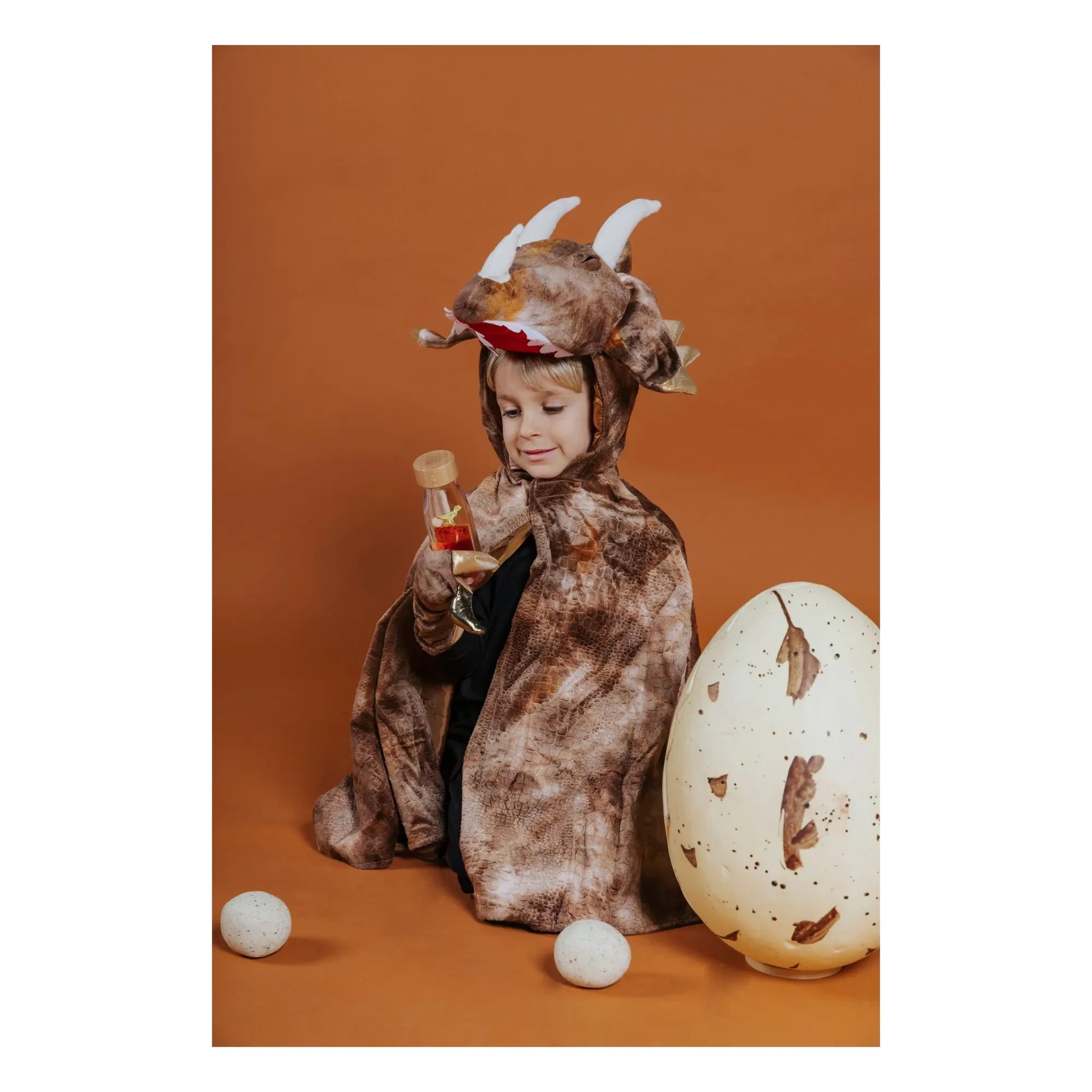 Petit Boum - Botella sensorial T-Rex | Naranja