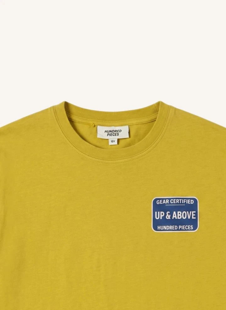 Hundred Pieces - Camiseta de Algodón Orgánico Certificada por Finn | Mostaza