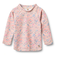 Trigo - Camiseta de fibra reciclada Dilan Fleuri con protección UV | Rosa claro