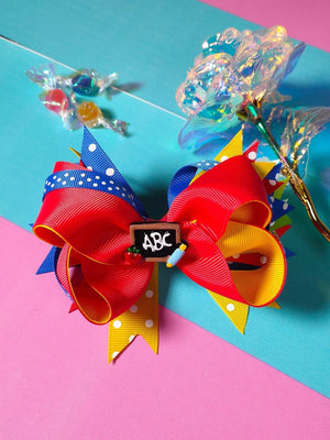 Dinossi - Pinza de pelo para niña con diseño ABC escolar