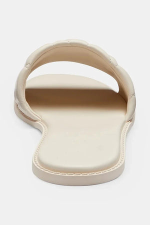 Sandalia Coach Holly Quilted Leather de piel plana para mujer